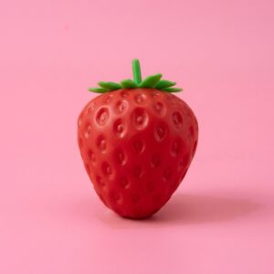 Red crunchy strawberry squishy with green leaves